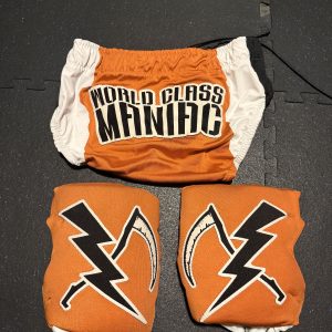 Eric Young SIGNED Ring Worn Trunks & Kneepads